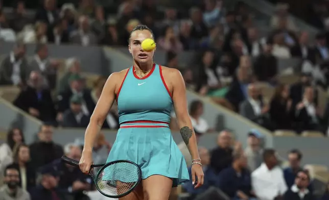 Aryna Sabalenka of Belarus reacts as she plays against Poland's Iga Swiatek during their semifinal match of the French Tennis Open at the Roland-Garros stadium in Paris, Thursday, June 5, 2025. (AP Photo/Lindsey Wasson)