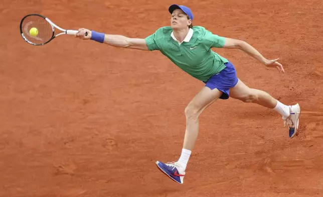 Italy's Jannik Sinner plays a shot against Serbia's Novak Djokovic during their semifinal match of the French Tennis Open at the Roland-Garros stadium in Paris, Friday, June 6, 2025. (AP Photo/Aurelien Morissard)