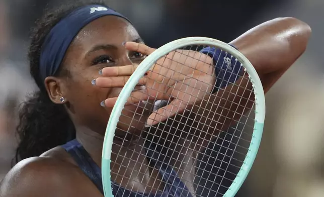 Coco Gauff of the U.S. celebrates as she won the semifinal match of the French Tennis Open against France's Lois Boisson at the Roland-Garros stadium in Paris, Thursday, June 5, 2025. (AP Photo/Lindsey Wasson)
