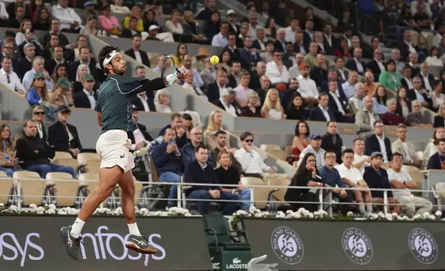 Italy's Lorenzo Musetti plays a shot against Spain's Carlos Alcaraz during their semifinal match of the French Tennis Open at the Roland-Garros stadium in Paris, Friday, June 6, 2025. (AP Photo/Lindsey Wasson)