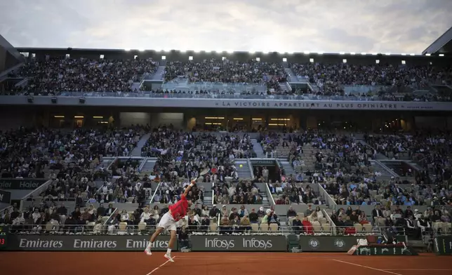 Serbia's Novak Djokovic plays a shot against Italy's Jannik Sinner during their semifinal match of the French Tennis Open at the Roland-Garros stadium in Paris, Friday, June 6, 2025. (AP Photo/Thibault Camus)