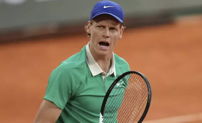 Italy's Jannik Sinner reacts as he plays against Serbia's Novak Djokovic during their semifinal match of the French Tennis Open at the Roland-Garros stadium in Paris, Friday, June 6, 2025. (AP Photo/Aurelien Morissard)