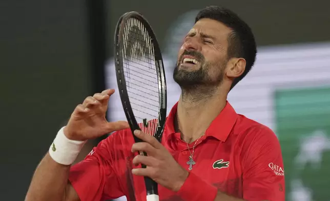 Serbia's Novak Djokovic reacts as he plays against Italy's Jannik Sinner during their semifinal match of the French Tennis Open at the Roland-Garros stadium in Paris, Friday, June 6, 2025. (AP Photo/Thibault Camus)