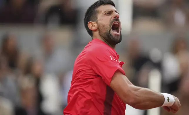 Serbia's Novak Djokovic reacts as he plays against Italy's Jannik Sinner during their semifinal match of the French Tennis Open at the Roland-Garros stadium in Paris, Friday, June 6, 2025. (AP Photo/Thibault Camus)