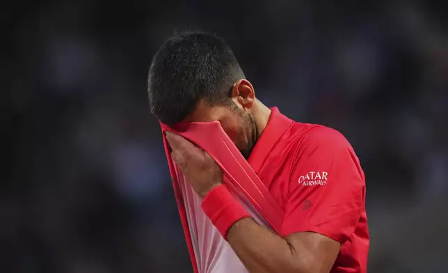Serbia's Novak Djokovic reacts during the semifinal match of the French Tennis Open against Italy's Jannik Sinner at the Roland-Garros stadium in Paris, Friday, June 6, 2025. (AP Photo/Lindsey Wasson)