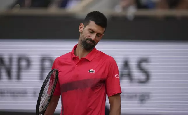 Serbia's Novak Djokovic reacts as he plays against Italy's Jannik Sinner during their semifinal match of the French Tennis Open at the Roland-Garros stadium in Paris, Friday, June 6, 2025. (AP Photo/Christophe Ena)
