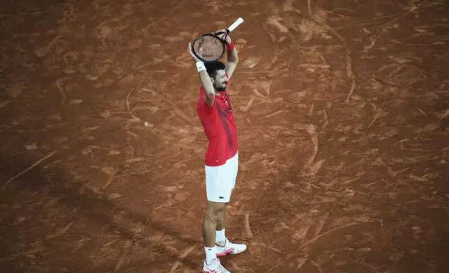Serbia's Novak Djokovic reacts as he plays against Italy's Jannik Sinner during their semifinal match of the French Tennis Open at the Roland-Garros stadium in Paris, Friday, June 6, 2025. (AP Photo/Christophe Ena)