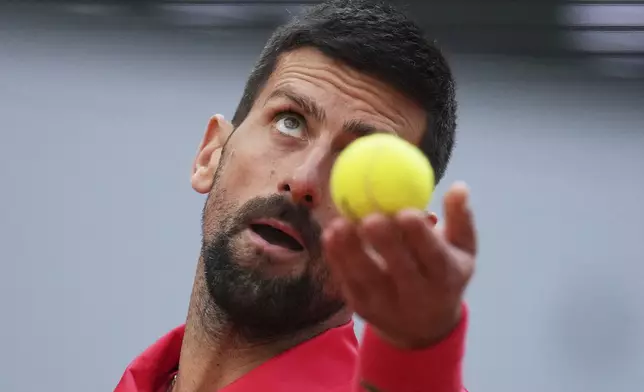 Serbia's Novak Djokovic serves against Italy's Jannik Sinner during their semifinal match of the French Tennis Open at the Roland-Garros stadium in Paris, Friday, June 6, 2025. (AP Photo/Christophe Ena)
