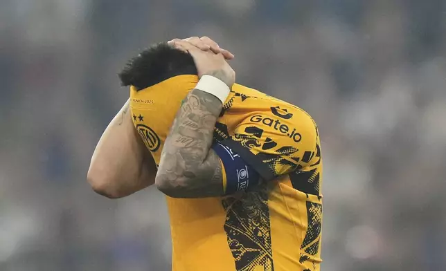 Inter Milan's team captain Lautaro Martinez reacts at the end of the Champions League final soccer match between Paris Saint-Germain and Inter Milan at the Allianz Arena in Munich, Germany, Saturday, May 31, 2025. (AP Photo/Luca Bruno)