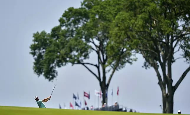 Alistair Docherty hits from the first fairway during a practice round ahead of the U.S. Open golf tournament at Oakmont Country Club Wednesday, June 11, 2025, in Oakmont, Pa. (AP Photo/Charlie Riedel)
