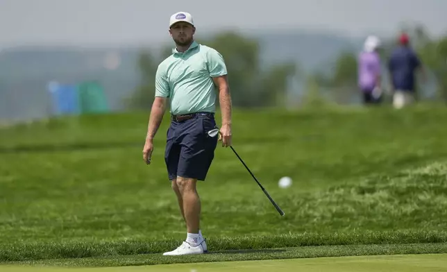 Alistair Docherty chips onto the fourth green during a practice round ahead of the U.S. Open golf tournament at Oakmont Country Club Wednesday, June 11, 2025, in Oakmont, Pa. (AP Photo/Carolyn Kaster)