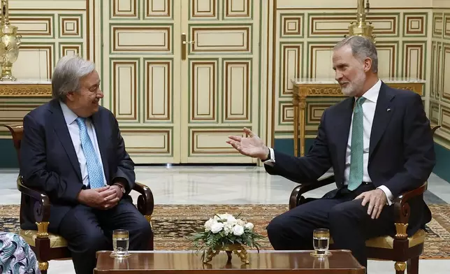 Spain's King Felipe VI, right, talks with the Secretary-General of the United Nations Antonio Guterres before the UN financing for development conference in Seville, Spain, Sunday June 29, 2025. (Chema Moya, Pool photo via AP)