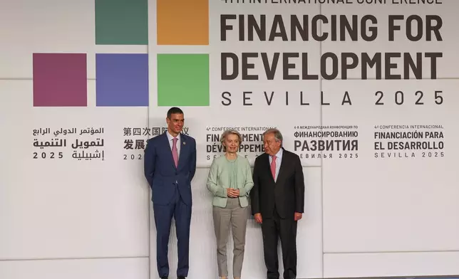 Spain's Prime Minister Pedro Sanchez, left, European Commission President Ursula von der Leyen, center, and Antonio Guterres, Secretary-General of the United Nations pose for a photo ahead of the four-day Financing for Development meeting in the southern city of Seville, Spain, Monday, June 30, 2025. (AP Photo/Jose Angel Garcia)