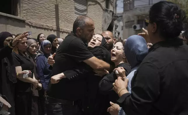 Relatives attend the funeral of four members of the Khatib family, Palestinian citizens of Israel killed in an Iranian missile strike on Tamra, Israel, on Tuesday, June 17, 2025. (AP Photo/Mahmoud Illean)