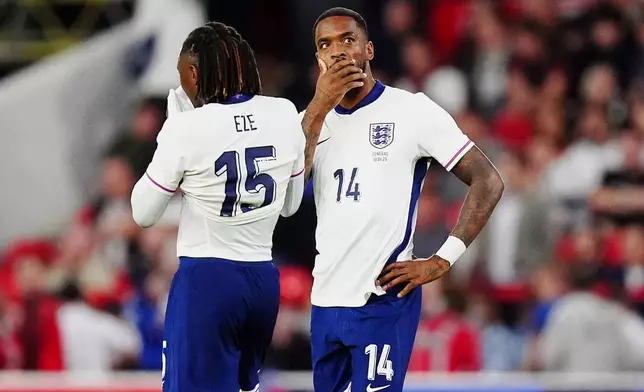 England's Ivan Toney (14) and England's Eberechi Eze react after Senegal's Cheikh Sabaly scores their side's third goal of the game during an international friendly match against Senegal at The City Ground in Nottingham, England, Tuesday, June 10, 2025. (Mike Egerton/PA via AP)