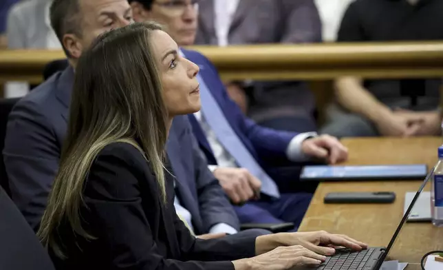 Defendant Karen Read listens as accident reconstruction specialist Dr. Daniel Wolfe testifies during her murder trial in Norfolk Superior Court, Friday, June 6, 2025, in Dedham, Mass. (Mark Stockwell/The Sun Chronicle via AP, Pool)