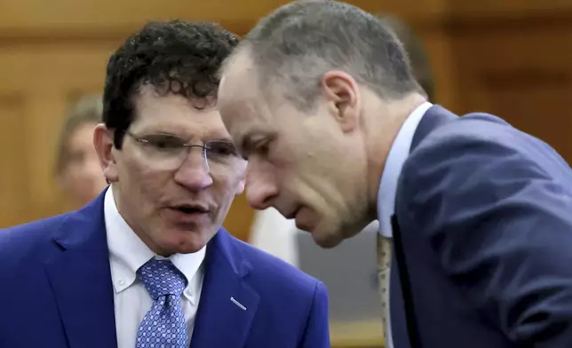 Defense attorneys Robert Alessi, left, and David Yannetti, confer before the Karen Read's murder trial in Norfolk Superior Court in Dedham, Mass., Friday, June 6, 2025. (Mark Stockwell/The Sun Chronicle via AP, Pool)