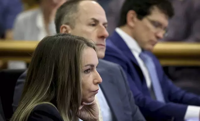 Karen Read and her defense attorneys listen as accident reconstruction specialist Dr. Daniel Wolfe testifies during Read's murder trial in Norfolk Superior Court in Dedham, Mass., Friday, June 6, 2025. (Mark Stockwell/The Sun Chronicle via AP, Pool)