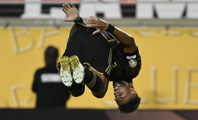 Los Angeles FC's Denis Bouanga celebrates after scoring the opening goal against Flamengo during the Club World Cup Group D soccer match between Los Angeles FC and Flamengo in Orlando, Fla., Tuesday, June 24, 2025. (AP Photo/Phelan Ebenhack)