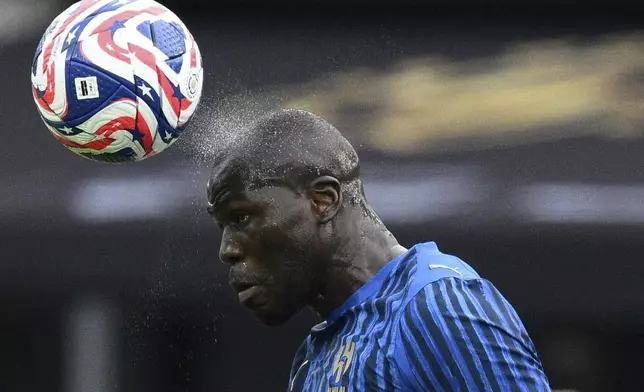 Al-Hilal's Kalidou Koulibaly heads the ball during the Club World Cup Group H soccer match between Salzburg and Al Hilal in Washington, Sunday, June 22, 2025. (AP Photo/Nick Wass)