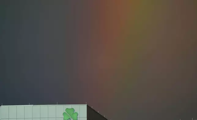 An office building stands against a rainbow after a severe storm passed through Overland Park, Kan. Thursday, June 26, 2025. (AP Photo/Charlie Riedel)