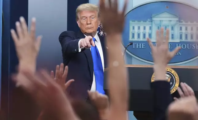 President Donald Trump points to a reporter to answer questions, Friday, June 27, 2025, in the briefing room of the White House in Washington. (AP Photo/Jacquelyn Martin)