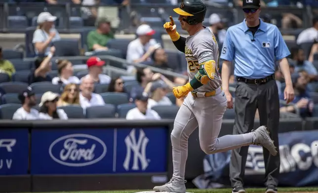 Athletics' Brent Rooker (25) celebrates a home run during the fourth inning of a baseball game against the New York Yankees, Saturday, June 28, 2025, in New York. (AP Photo/Angelina Katsanis)