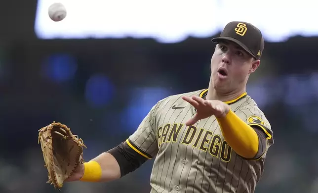 San Diego Padres' Gavin Sheets throws to first base during the sixth inning of a baseball game against the Milwaukee Brewers, Sunday, June 8, 2025, in Milwaukee. (AP Photo/Aaron Gash)