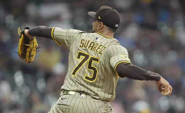 San Diego Padres' Robert Suarez pitches during the ninth inning of a baseball game against the Milwaukee Brewers, Sunday, June 8, 2025, in Milwaukee. (AP Photo/Aaron Gash)
