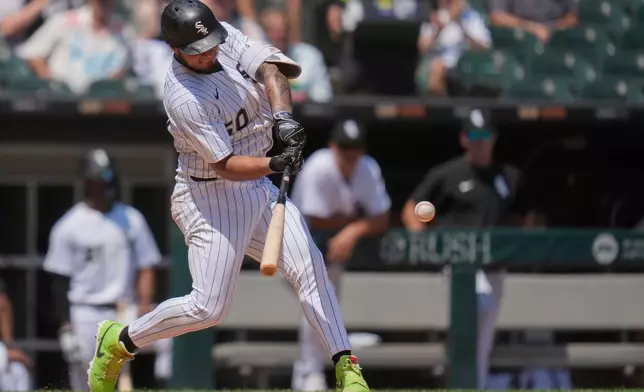 Chicago White Sox's Lenyn Sosa (50) hits a two-run home run during the fourth inning of a baseball game against the Arizona Diamondbacks, Wednesday, June 25, 2025, in Chicago. (AP Photo/Erin Hooley)