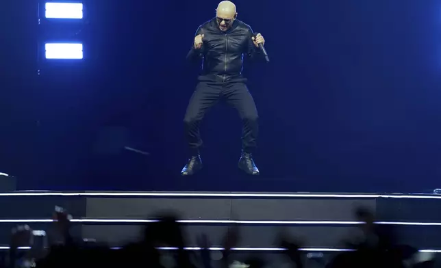 Pitbull performs in concert on Monday, June 9, 2025, in London.(Photo by Scott A Garfitt/Invision/AP)