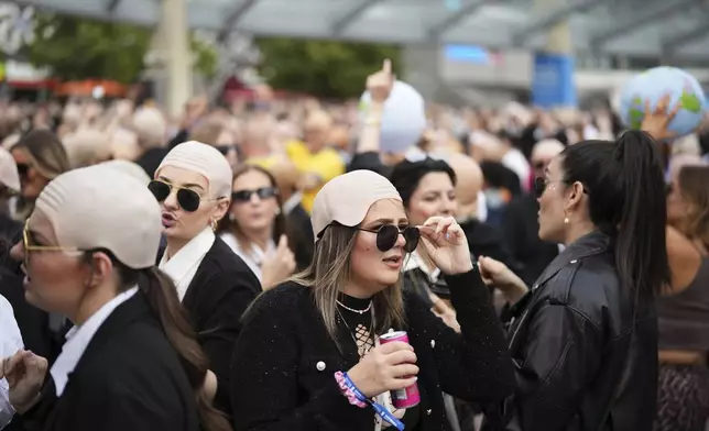 Fans gather in front of the O2 Arena prior to a performance by Pitbull on Monday, June 9, 2025, in London. (Photo by Scott A Garfitt/Invision/AP)