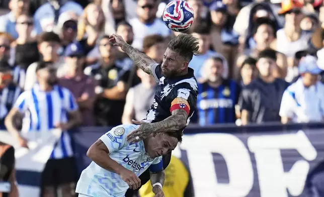 Monterrey's Sergio Ramos, top, and Inter Milan's Lautaro Martinez battle for the ball during the Club World Cup group E soccer match between CF Monterrey and Inter Milan in Pasadena, Calif., Tuesday, June 17, 2025. (AP Photo/Gregory Bull)