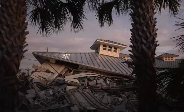 FILE - A collapsed building is visible after Hurricane Milton, on Manasota Key, Fla., Saturday, Oct. 12, 2024. (AP Photo/Rebecca Blackwell, File)