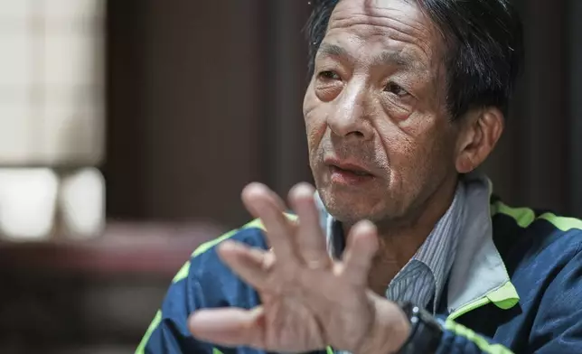 Masatsugu Tanimoto, a farmer and a community leader who is one of only hundreds of so-called "hidden" Christians on the island of Ikitsuki, speaks at his home in Ikitsuki Island in Hirado, southern Japan, Sunday, April 27, 2025. (AP Photo/Eugene Hoshiko)