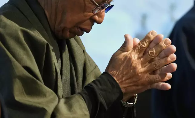 Yoshitaka Oishi and others chant "Orasho" prayers during their annual performance at the Ikitsuki Island Museum "Shima no Yakata" in Ikitsuki Island in Hirado, southern Japan, Tuesday, April 29, 2025. (AP Photo/Hiro Komae)