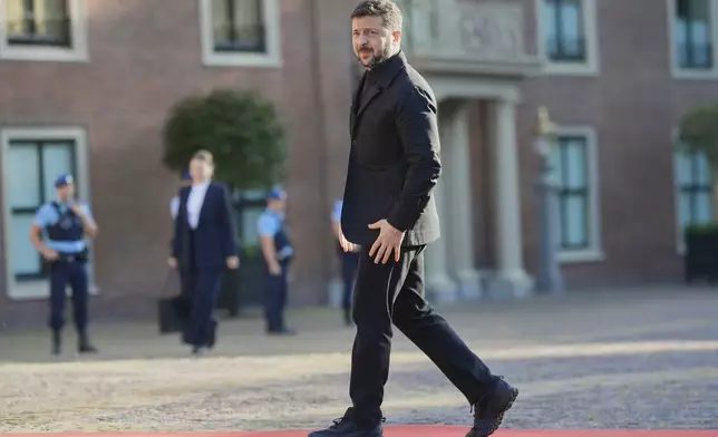 Ukraine's President Volodymyr Zelenskyy arrives ahead of a formal dinner at the Paleis Huis ten Bosch ahead of the NATO summit in The Hague, Netherlands, Tuesday, June 24, 2025. (AP Photo/Markus Schreiber)