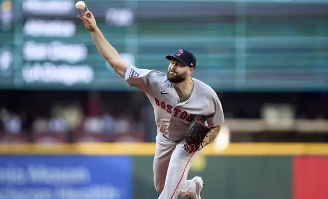 Boston Red Sox starting pitcher Lucas Giolito throws against the Seattle Mariners during the first inning of a baseball game Monday, June 16, 2025, in Seattle. (AP Photo/John Froschauer)