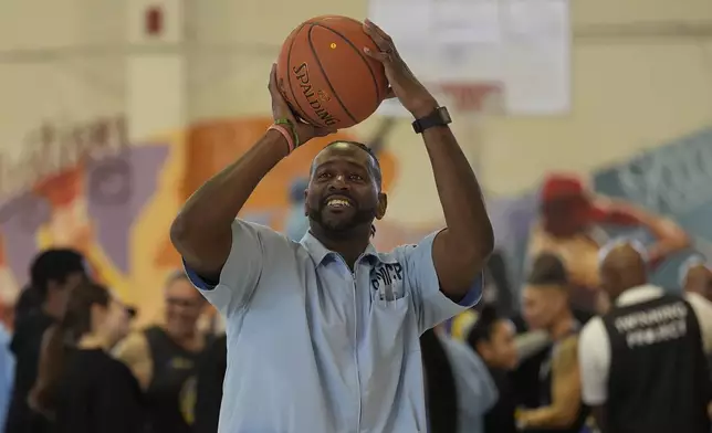 Ray Woodfork, a graduate of Twinning Project's collaboration with the NBA's Golden State Warriors and the California Department of Corrections and Rehabilitation's cohort 1, shoots a basket at Solano State Prison in Vacaville, Calif., Tuesday, Feb. 11, 2025. (AP Photo/Jeff Chiu)