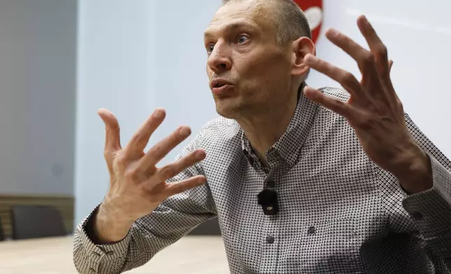 Syarhei Tsikhanouski, a Belarusian opposition activist released from a prison by Belarusian authorities, gestures during an interview with the Associated Press in Vilnius, Lithuania, Sunday, June 22, 2025. (AP Photo/Mindaugas Kulbis)