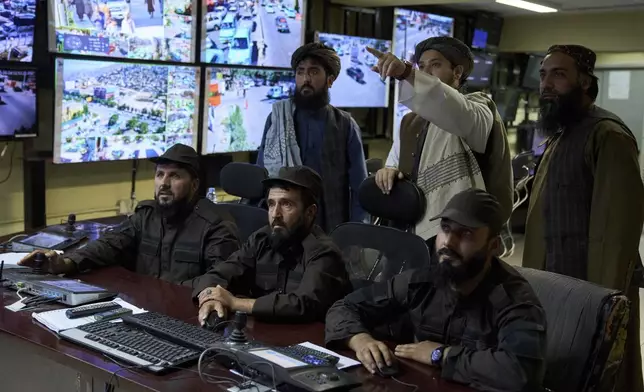 Taliban officials monitor the city's security at the city's security camera control center ahead of Eid al-Adha, or "Feast of the Sacrifice", in Kabul, Afghanistan, Wednesday, June 4, 2025. (AP Photo/Ebrahim Noroozi)