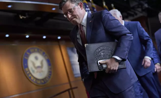 Speaker of the House Mike Johnson, R-La., departs after speaking with reporters to discuss work on President Donald Trump's bill of tax breaks and spending cuts, at the Capitol in Washington, Wednesday, June 4, 2025. (AP Photo/J. Scott Applewhite)