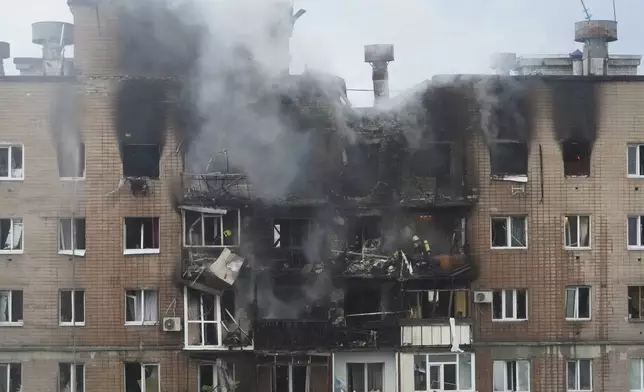 A view after a Russian attack that hit a residential building in Kharkiv, Ukraine, Saturday, June 7, 2025. (AP Photo/Andrii Marienko)