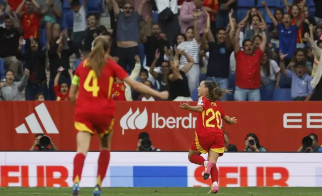 Spain's Claudia Pina, right, celebrates after scoring her side's second goal during the women's Nations League soccer match between Spain and England at the RCD Espanyol Stadium, in Barcelona, Spain, Tuesday, June 3, 2025. (AP Photo/Joan Monfort)