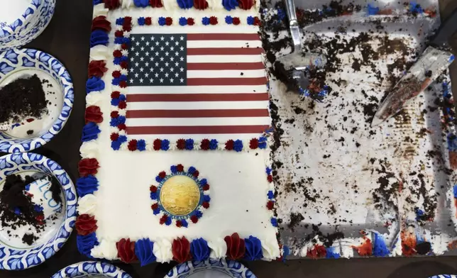 A U.S. flag is seen on a piece of cake for attendees after a news conference near the Trans-Alaska Pipeline at the Pump Station 1 on Monday, June 2, 2025, located near Deadhorse, Alaska, on the state's prodigious North Slope. (AP Photo/Jenny Kane)