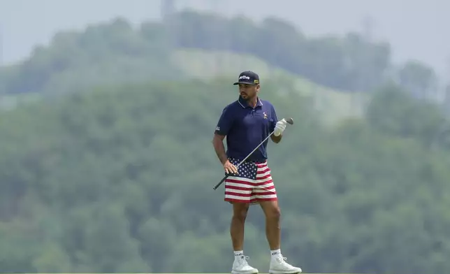 Australian golfer Jason Day, wears U.S. flag-themed shorts as he prepares to putt during a practice round ahead of the U.S. Open golf tournament at Oakmont Country Club Tuesday, June 10, 2025, in Oakmont, Pa. (AP Photo/Charlie Riedel)