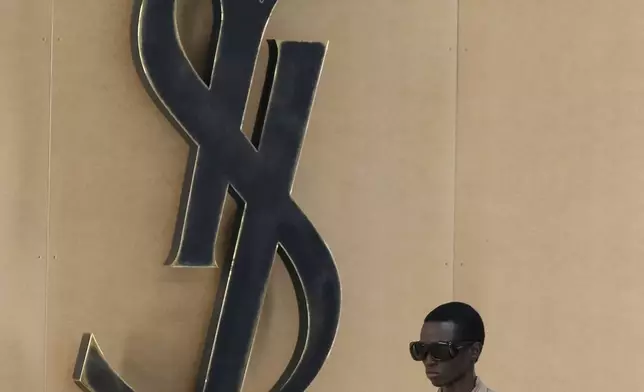A model wears a creation as part of the men's Saint Laurent Spring-Summer 2026 collection, that was presented in Paris, Tuesday, June 24, 2025. (AP Photo/Michel Euler)