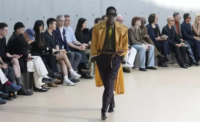 A model wears a creation as part of the men's Saint Laurent Spring-Summer 2026 collection, that was presented in Paris, Tuesday, June 24, 2025. (AP Photo/Michel Euler)