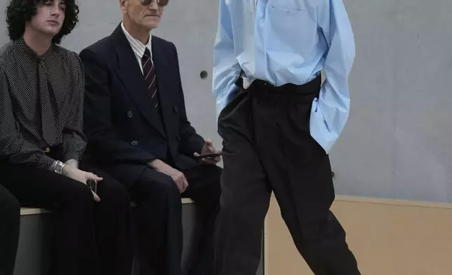 A model wears a creation as part of the men's Saint Laurent Spring-Summer 2026 collection, that was presented in Paris, Tuesday, June 24, 2025. (AP Photo/Michel Euler)