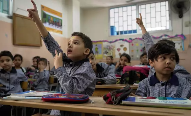 Students in an English class at a primary school run by UNRWA for Palestinian refugees at the Mar Elias refugee camp in Beirut, Lebanon, Monday, June 2, 2025. (AP Photo/Hassan Ammar)